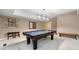 Entertaining game room features a pool table, comfortable seating, and bright lighting at 5276 Weatherwood Trce, Marietta, GA 30068