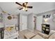 Cozy bedroom with playful decor, ceiling fan and adjacent closet at 542 Broughton Dr, Canton, GA 30114
