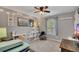 Bedroom featuring neutral tones, plush chair and natural light from a window at 542 Broughton Dr, Canton, GA 30114
