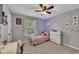 Bright bedroom with a white frame bed, soft lighting and ample closet space at 542 Broughton Dr, Canton, GA 30114