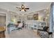 Charming bedroom featuring a ceiling fan, string lights, and creative workspace for crafts and hobbies at 542 Broughton Dr, Canton, GA 30114