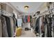 Spacious walk-in closet with ample shelving and storage for clothes and accessories at 542 Broughton Dr, Canton, GA 30114