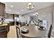 Open concept kitchen and dining with barstool seating at large center island at 542 Broughton Dr, Canton, GA 30114