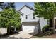 Charming two-story home with a two-car garage and well-manicured landscaping at 542 Broughton Dr, Canton, GA 30114
