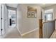 Upstairs hallway with plush carpet and access to all bedrooms at 542 Broughton Dr, Canton, GA 30114