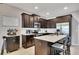 Modern kitchen with stainless steel appliances, granite countertops, and ample cabinet space at 542 Broughton Dr, Canton, GA 30114