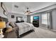 Spacious main bedroom with tray ceiling, fan, and ensuite bathroom at 542 Broughton Dr, Canton, GA 30114