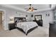 Spacious main bedroom with tray ceiling, fan, and ensuite bathroom at 542 Broughton Dr, Canton, GA 30114