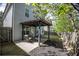 Cozy outdoor patio featuring a stylish pergola covering dining area, ideal for entertaining guests at 542 Broughton Dr, Canton, GA 30114