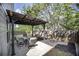 Backyard patio featuring a metal pergola and an outdoor dining set, perfect for outdoor living at 542 Broughton Dr, Canton, GA 30114