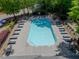 Overhead view of a community pool with plenty of lounge chairs and clear blue water at 542 Broughton Dr, Canton, GA 30114