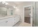 Bright bathroom with granite countertop vanity and access to the shower and bedroom at 6340 Arlington Cir, Cumming, GA 30041