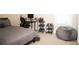 Relaxing bedroom with comfortable bed, a desk with computer, and beanbag chair at 6340 Arlington Cir, Cumming, GA 30041