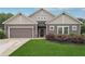 Charming single-story home with well-maintained lawn, gray siding, and inviting entrance at 6340 Arlington Cir, Cumming, GA 30041