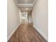 Inviting hallway with wood-look floors, leading to the main living areas and stairs at 6340 Arlington Cir, Cumming, GA 30041