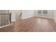 Hallway with hardwood floors and stairs at 6340 Arlington Cir, Cumming, GA 30041