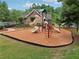 Community playground featuring slides and climbing equipment for children to enjoy in a safe environment at 6340 Arlington Cir, Cumming, GA 30041