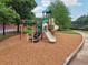 Community playground featuring slides and climbing equipment for children to enjoy in a safe environment at 6340 Arlington Cir, Cumming, GA 30041