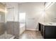 Modern primary bathroom with double vanity, walk-in shower, and soaking tub at 739 Rolling Downs Dr, Loganville, GA 30052
