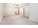 Serene primary bedroom boasting tray ceilings, neutral paint, and plush carpeting at 739 Rolling Downs Dr, Loganville, GA 30052