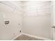 Walk-in closet features wire shelving and ample storage space at 739 Rolling Downs Dr, Loganville, GA 30052