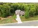 Pictureque aerial view of the traditional home with its well manicured lawn and two car garage at 632 Creekside Trce, Covington, GA 30014