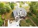 A scenic aerial perspective of the home showcasing the backyard, patio, and well-manicured lawn at 632 Creekside Trce, Covington, GA 30014