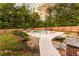 Backyard with pool, fenced perimeter, and mature trees at 632 Creekside Trce, Covington, GA 30014