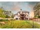 Spacious grassy backyard with a wood fence, screened in porch and some trees at 632 Creekside Trce, Covington, GA 30014