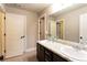 Well-lit bathroom featuring a double vanity with granite countertops and modern fixtures at 632 Creekside Trce, Covington, GA 30014