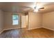 Bedroom featuring wood-look floors, neutral paint, and a ceiling fan at 632 Creekside Trce, Covington, GA 30014
