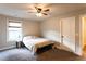 Bright bedroom with a window and ceiling fan, offering a comfortable and inviting atmosphere at 632 Creekside Trce, Covington, GA 30014