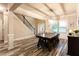 Charming dining area with wood floors and open staircase; a comfortable entryway from the front door at 632 Creekside Trce, Covington, GA 30014