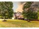 Beautiful two-story home with brick and stone accents, professional landscaping, and a lush lawn at 632 Creekside Trce, Covington, GA 30014
