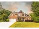 Charming two-story brick home with a well-manicured lawn and attached two car garage at 632 Creekside Trce, Covington, GA 30014