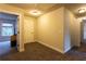 Neutral hallway with multiple rooms leading off of it and plush carpet throughout at 632 Creekside Trce, Covington, GA 30014