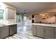 Kitchen with stainless steel dishwasher and an open view to the living room at 632 Creekside Trce, Covington, GA 30014