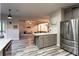 Spacious kitchen with stainless steel appliances and a view into the living room at 632 Creekside Trce, Covington, GA 30014