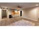 Finished basement with a kitchenette, wood flooring, and recessed lighting, providing a versatile space at 632 Creekside Trce, Covington, GA 30014
