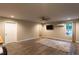 Spacious living room with wood-look floors, modern ceiling fan, and natural light at 632 Creekside Trce, Covington, GA 30014