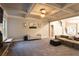 Spacious living room boasts trey ceilings, neutral paint, plush carpet, fireplace and lots of natural light at 632 Creekside Trce, Covington, GA 30014