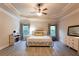 Large bedroom with trey ceilings, ceiling fan, and large windows at 632 Creekside Trce, Covington, GA 30014