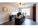 Office features wood-look floors, neutral paint, a window, and a large workspace at 632 Creekside Trce, Covington, GA 30014