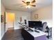 Office featuring wood-look floors, neutral paint, a window, and ceiling fan at 632 Creekside Trce, Covington, GA 30014