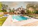 Backyard featuring a large in-ground pool, a hot tub, and a spacious deck for lounging at 632 Creekside Trce, Covington, GA 30014
