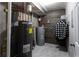Unfinished utility room featuring hot water tanks and plumbing at 632 Creekside Trce, Covington, GA 30014