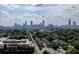 Panoramic view of the Atlanta skyline with lush green trees and neighborhood at 1320 Hosea L Williams Ne Dr, Atlanta, GA 30317