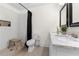 Modern bathroom featuring a shower with subway tile, wood stool and vanity with marble countertop at 1320 Hosea L Williams Ne Dr, Atlanta, GA 30317