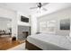 Comfortable bedroom features a brick fireplace and a large window with natural light at 1320 Hosea L Williams Ne Dr, Atlanta, GA 30317