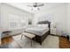 Bright bedroom showcasing hardwood floors, large windows and a decorative bench seat at 1320 Hosea L Williams Ne Dr, Atlanta, GA 30317